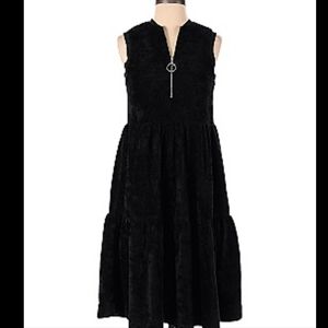 The lines in Between black sleeveless dress with zippered front